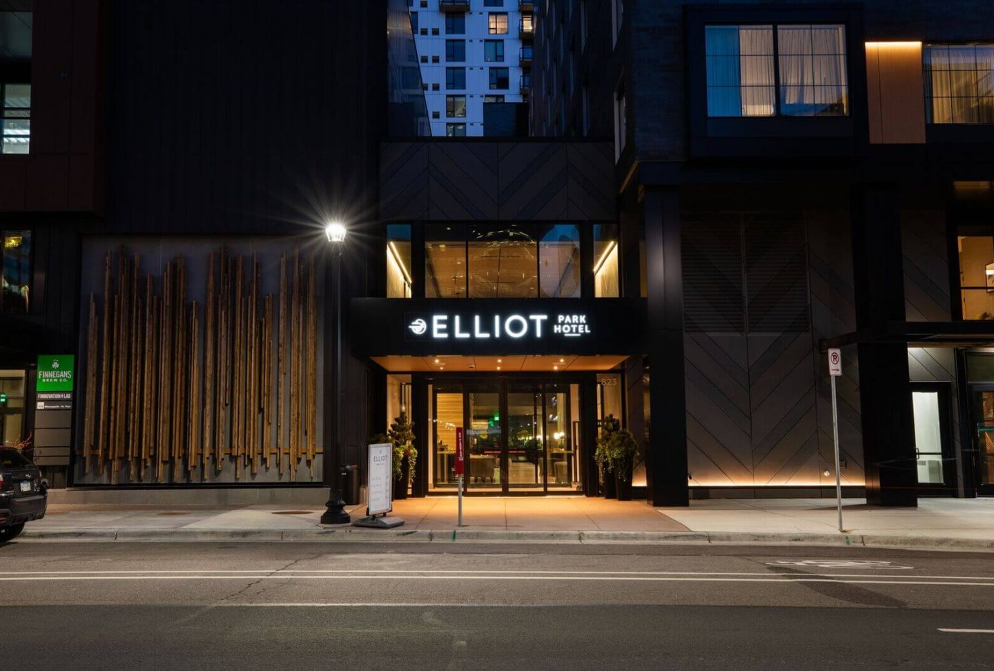 View of entrance to Elliot Park Hotel at night